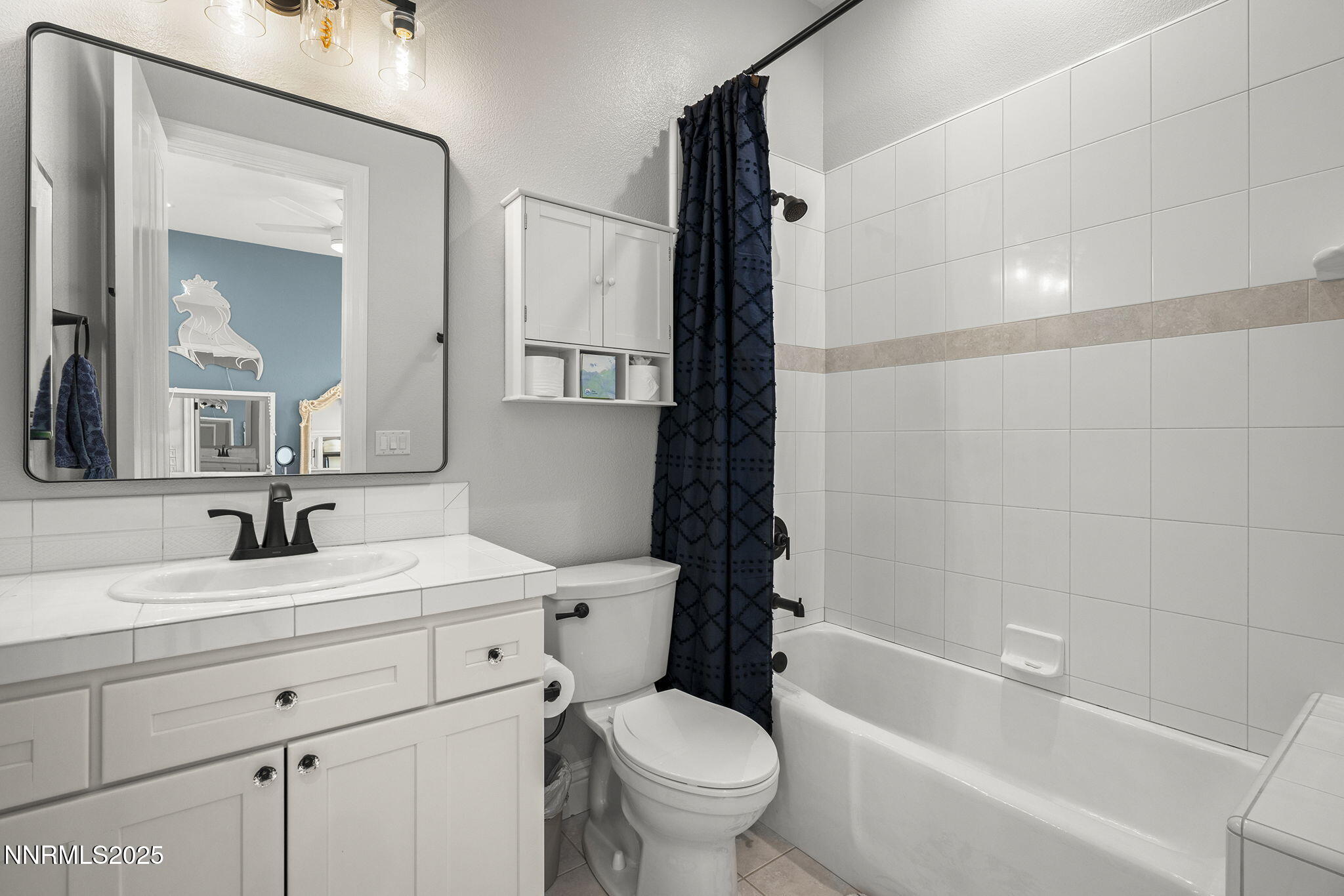 1465 Taos Lane Reno, NV 89511 - Photo 35 of 60 a bathroom with a sink toilet vanity and shower
