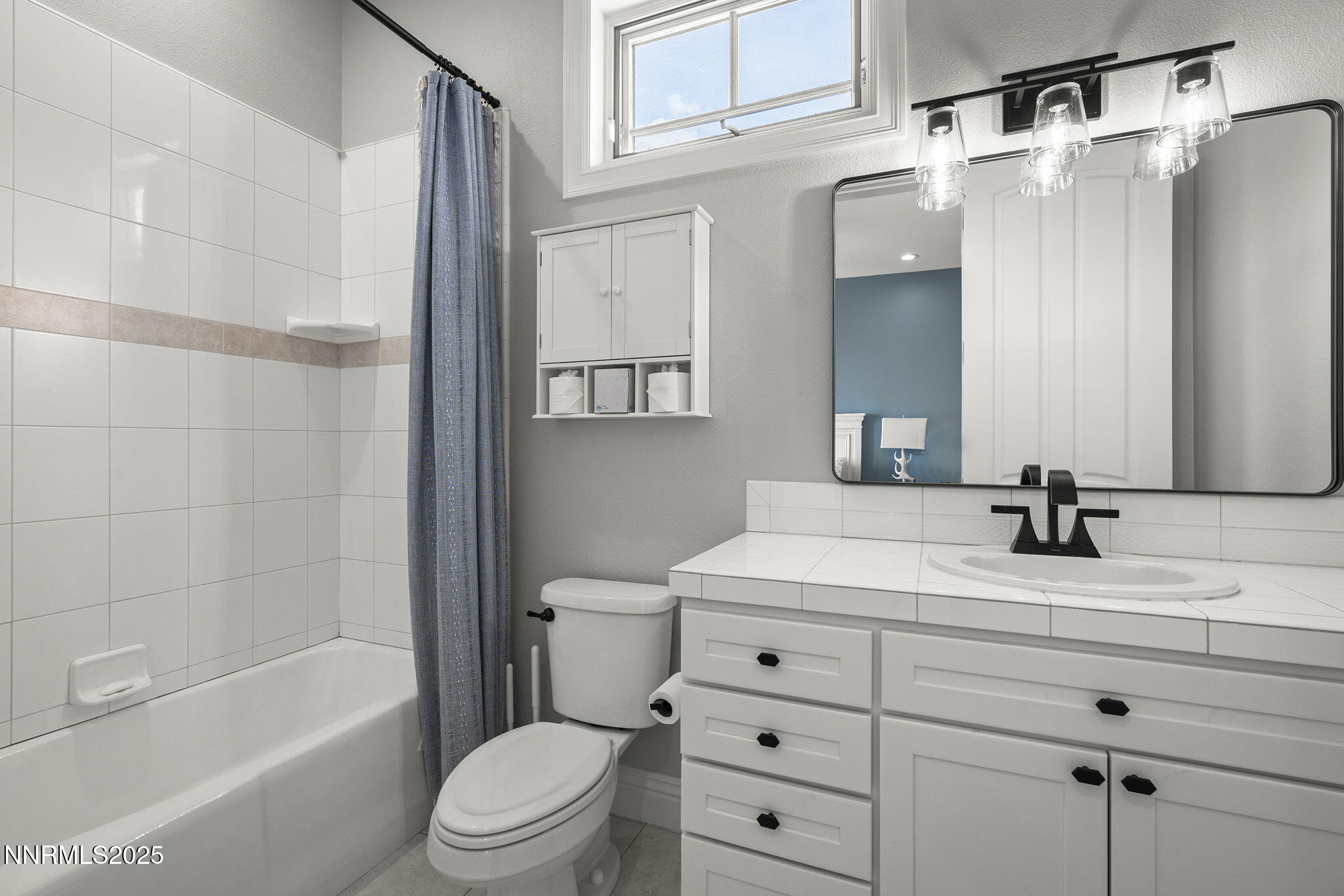 1465 Taos Lane Reno, NV 89511 - Photo 37 of 60 a bathroom with a sink a toilet and shower