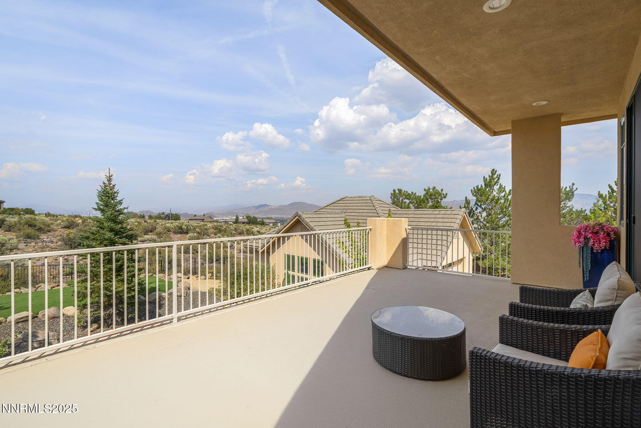 1465 Taos Lane Reno, NV 89511 - Photo 40 of 60 a view of a balcony with lake view and a potted plant