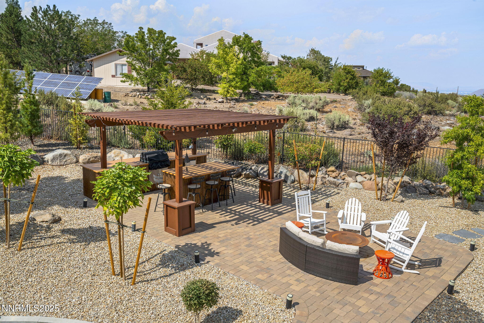 1465 Taos Lane Reno, NV 89511 - Photo 43 of 60 a view of a chairs and table in backyard