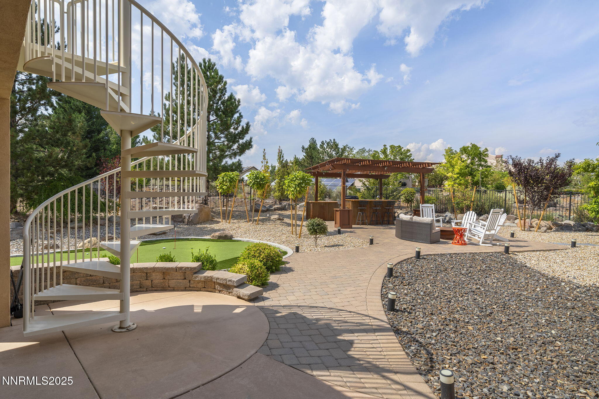 1465 Taos Lane Reno, NV 89511 - Photo 45 of 60 a view of a swimming pool with a patio and a garden