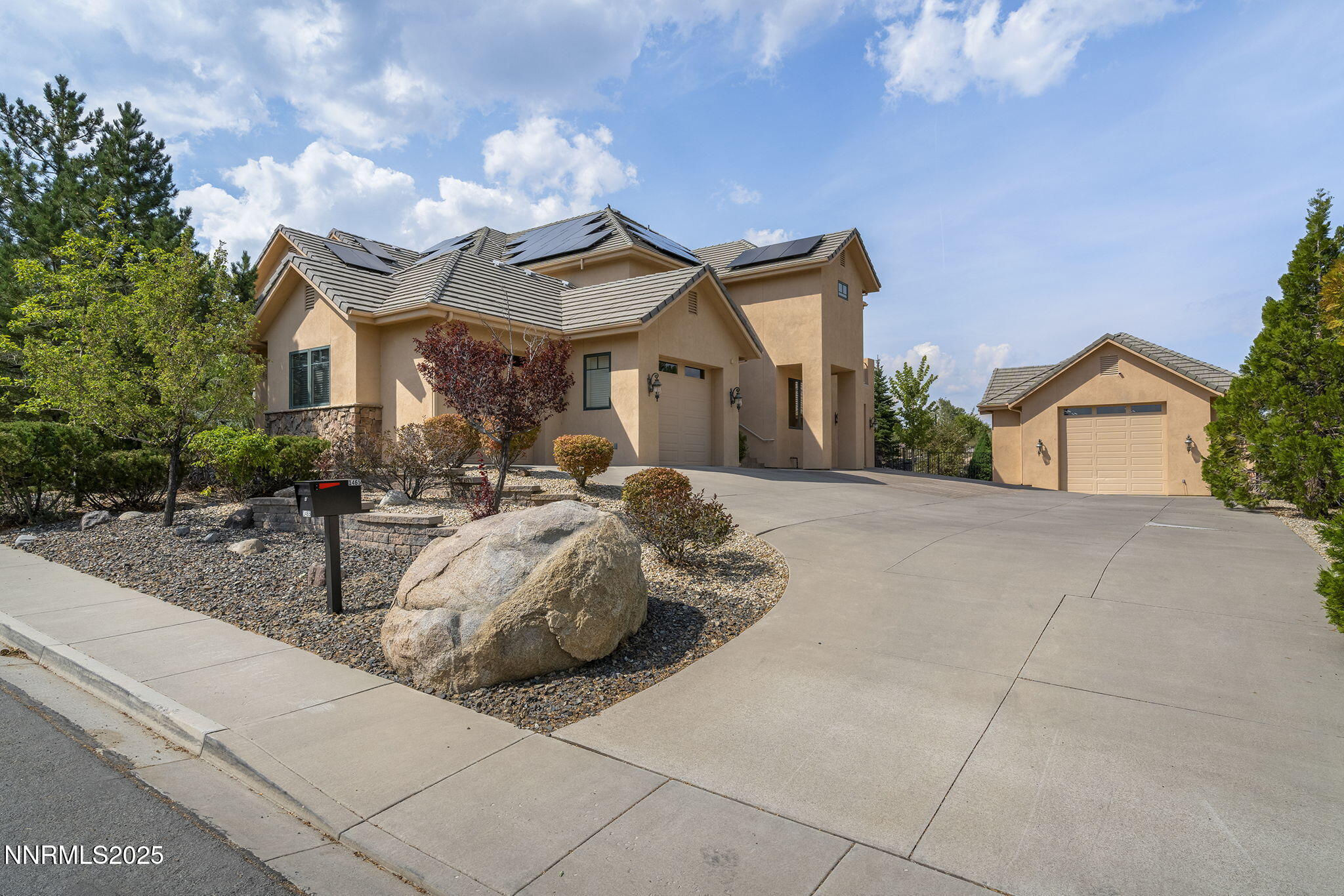 1465 Taos Lane Reno, NV 89511 - Photo 54 of 60 a front view of a house with sitting area and garden