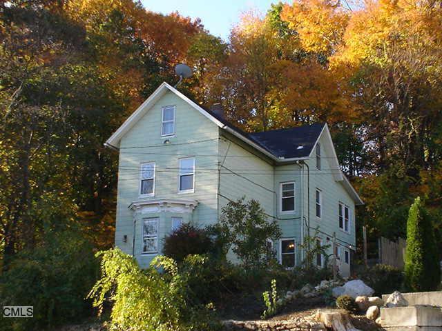 37 Riverside Avenue Norwalk, CT 06850 - Photo 1 of 1 a view of a house with a yard