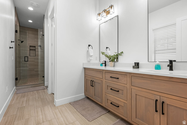 5354 Cyan Lane St. George, UT 84790 - Photo 13 of 45 Bathroom with a shower stall, double vanity, and recessed lighting