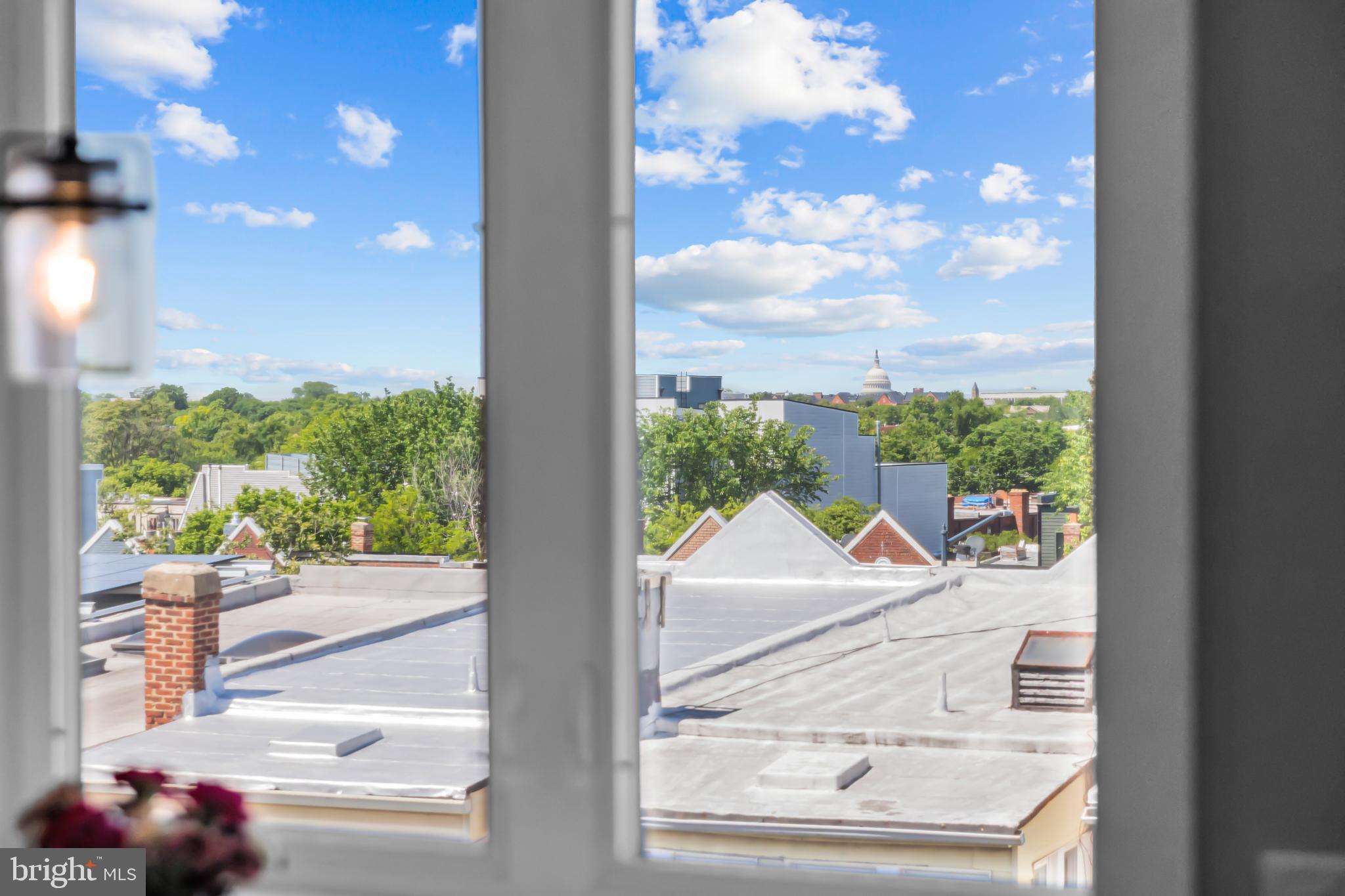 1915 H Street Northeast, Unit PH1 Washington, DC 20002 - Photo 9 of 21 a view of a glass door with a balcony from a window