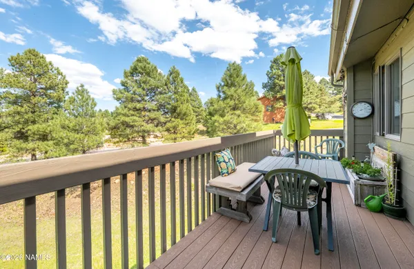 a view of a balcony with furniture