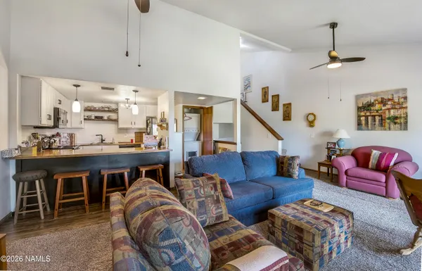 a living room with furniture and a table