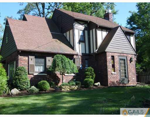 439 Chain O' Hills Road Colonia, NJ 07067 - Photo 1 of 10 a front view of a house with a garden and plants
