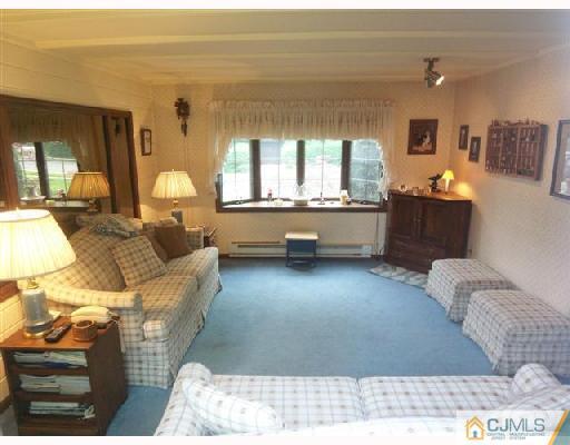 439 Chain O' Hills Road Colonia, NJ 07067 - Photo 3 of 10 a living room with furniture and a large window