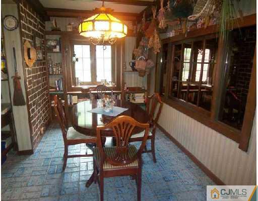439 Chain O' Hills Road Colonia, NJ 07067 - Photo 4 of 10 a view of a dining room with furniture and a chandelier
