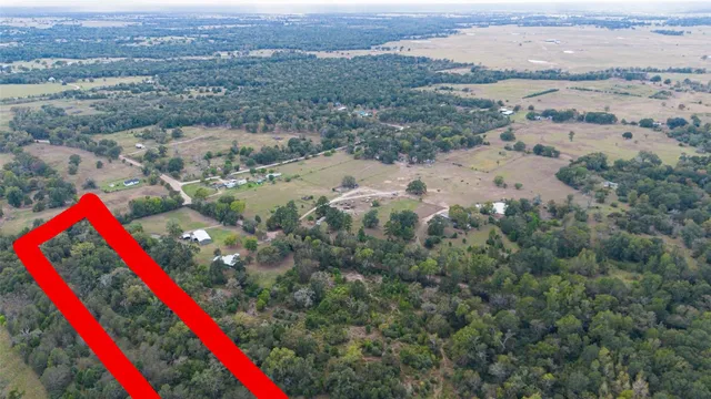 an aerial view of red and white house