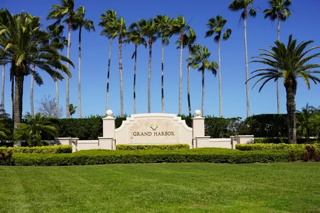 a view of house with swimming pool and green space