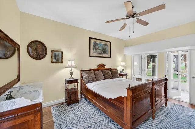 a bed room with a bed and a chandelier