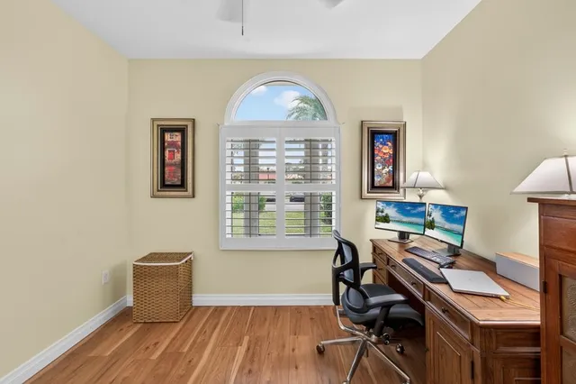 a workspace with furniture hardwood and a window