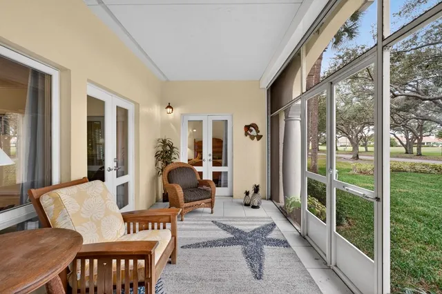 a view of a room with furniture and wooden floor