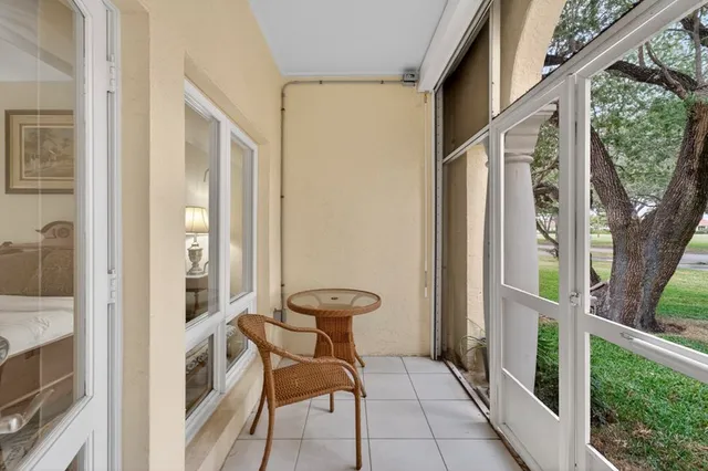 a view of balcony with furniture and garden