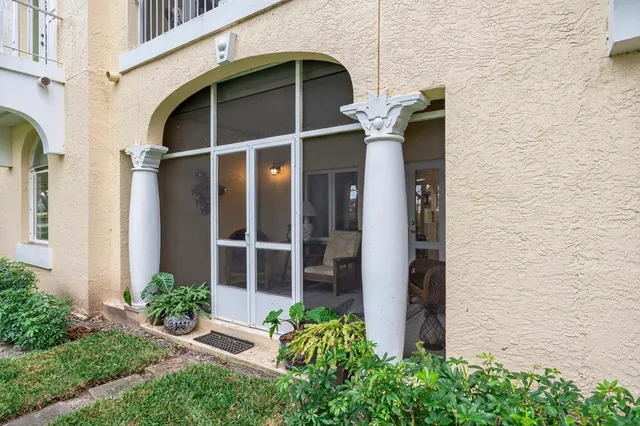 a couple of potted plants in front of door