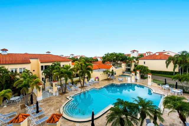 a view of a swimming pool with a patio
