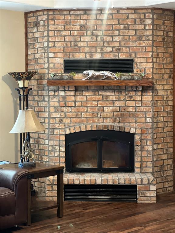 8505 County Road 500 Blue Ridge, TX 75424 - Photo 12 of 39 a living room with furniture a flat screen tv and a fireplace