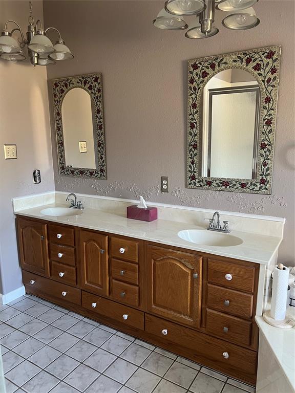 8505 County Road 500 Blue Ridge, TX 75424 - Photo 19 of 39 a bathroom with a double vanity sink and a mirror