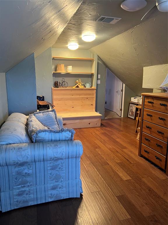 8505 County Road 500 Blue Ridge, TX 75424 - Photo 22 of 39 a bedroom with a bed and wooden floor