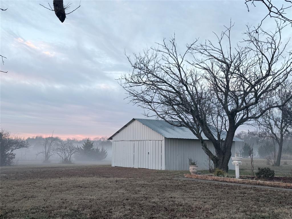 8505 County Road 500 Blue Ridge, TX 75424 - Photo 34 of 39 a view of a backyard with large trees