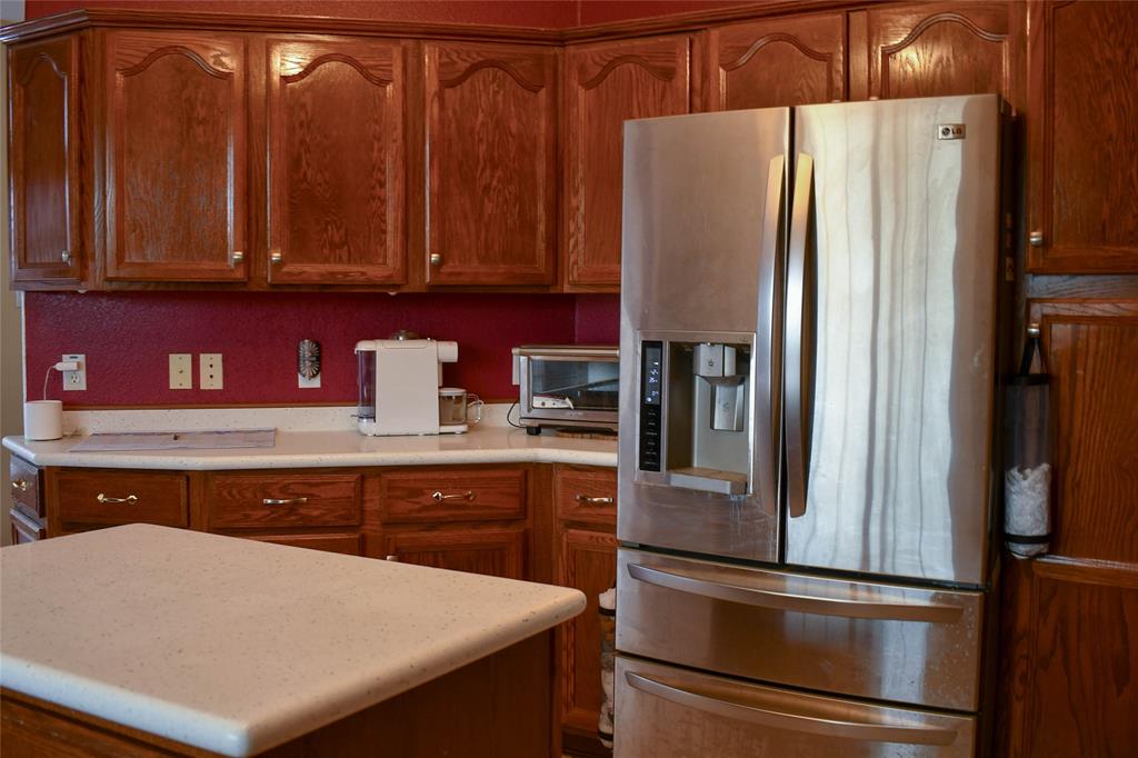 8505 County Road 500 Blue Ridge, TX 75424 - Photo 6 of 39 a kitchen with stainless steel appliances a refrigerator and cabinets
