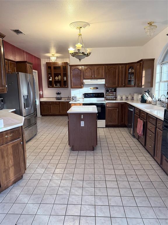 8505 County Road 500 Blue Ridge, TX 75424 - Photo 8 of 39 a large kitchen with stainless steel appliances and lots of counter space