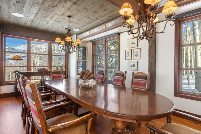 a bedroom with a bed chair and a large window
