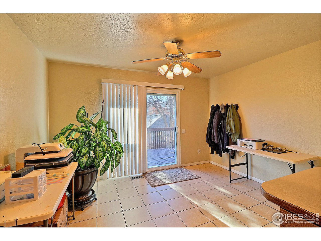 4924 10th Street Road Greeley, CO 80634 - Photo 14 of 24 Dining Area with Access to Deck