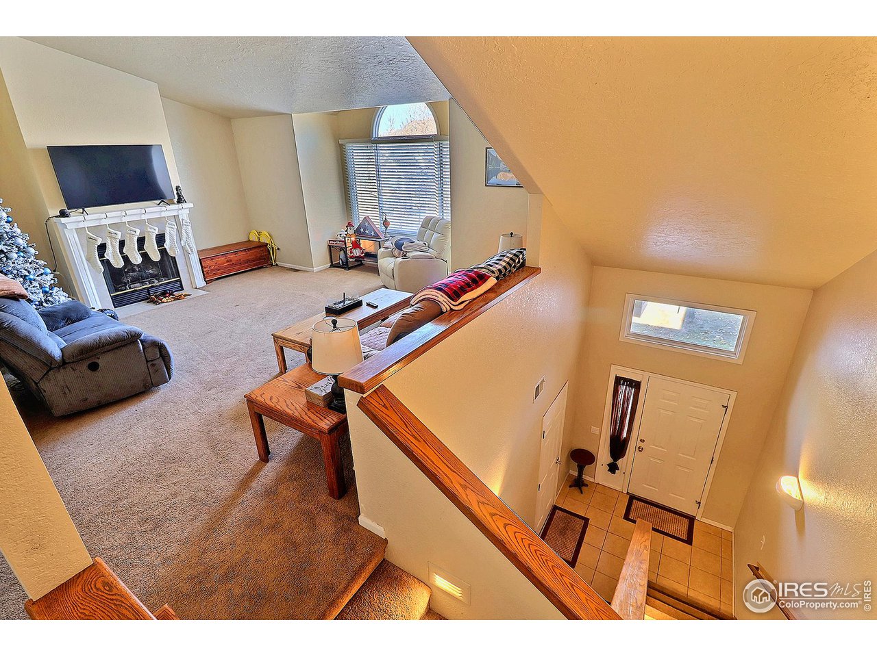 4924 10th Street Road Greeley, CO 80634 - Photo 5 of 24 Entryway-Stairway Takes You Up to The Main Living Quarters