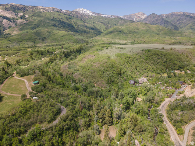 6449 North North Fork Road Eden, UT 84310 - Photo 27 of 38 Expansive mountain landscape featuring lush green foliage and distant snow-capped peaks