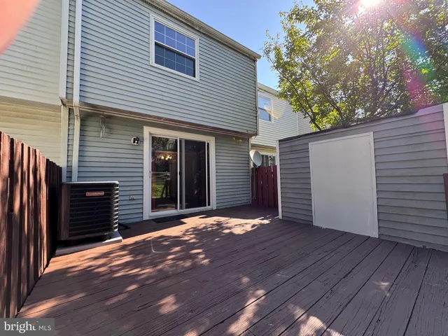 a view of a house with a door and wooden floor
