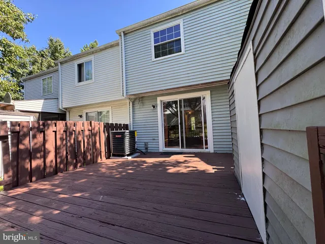 a view of a house with wooden floor and a garage