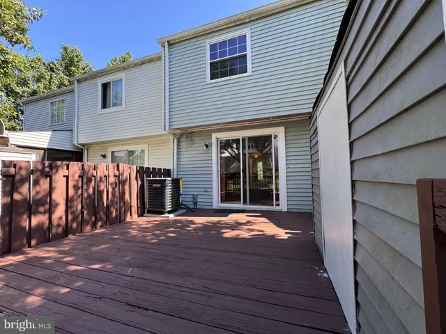 a view of a house with wooden door and a window
