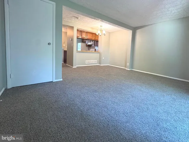 a view of empty room with floor to ceiling window