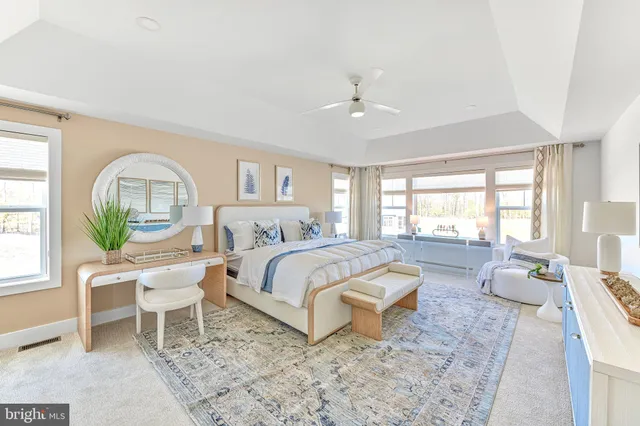 a bed room with a bed and a chair