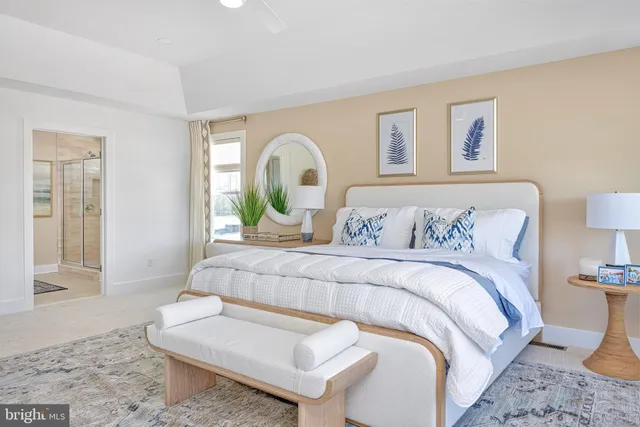 a bedroom with a bed and glass windows