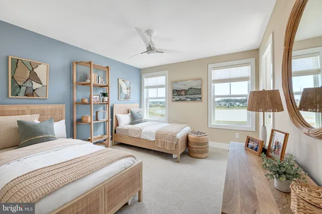 a bedroom with a large bed and a large window