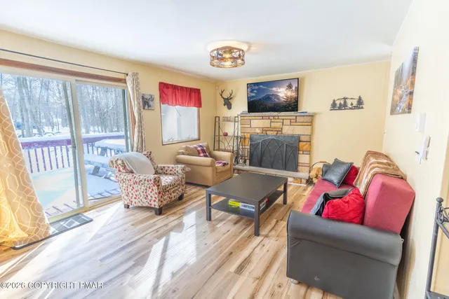 a living room with furniture and a flat screen tv