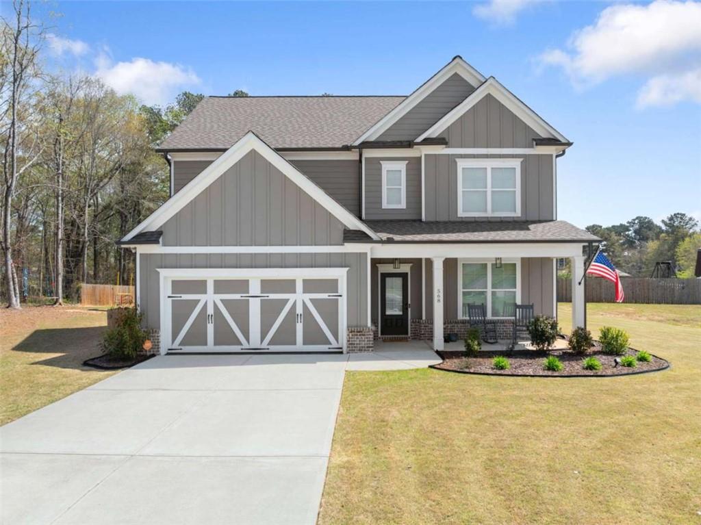 568 Dunagan Court Winder, GA 30680 - Photo 1 of 61 a front view of a house with a yard