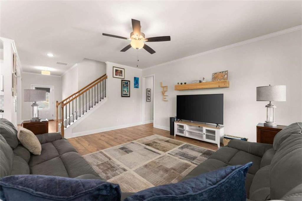 568 Dunagan Court Winder, GA 30680 - Photo 15 of 61 a living room with furniture and a flat screen tv