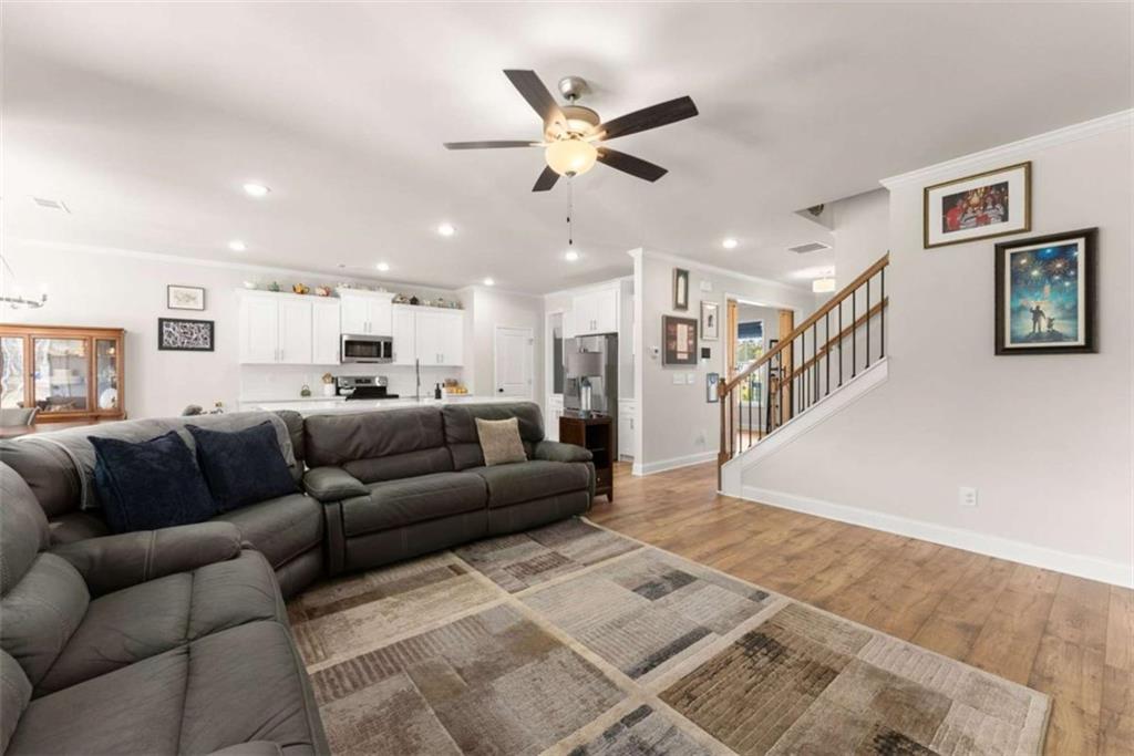 568 Dunagan Court Winder, GA 30680 - Photo 22 of 61 a living room with furniture and a ceiling fan
