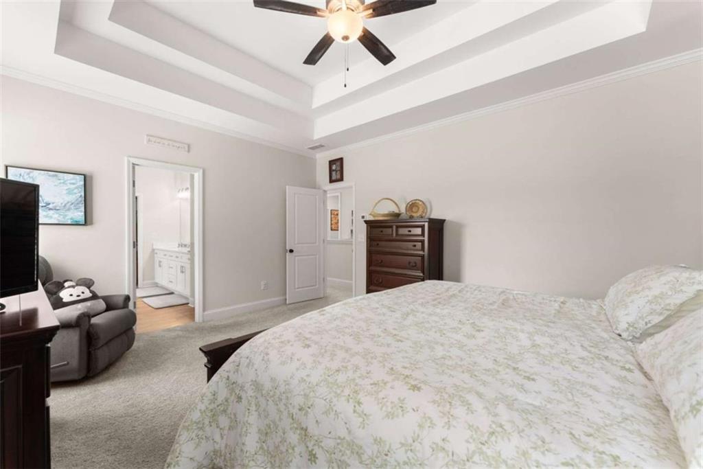 568 Dunagan Court Winder, GA 30680 - Photo 28 of 61 a bedroom with a bed and dresser