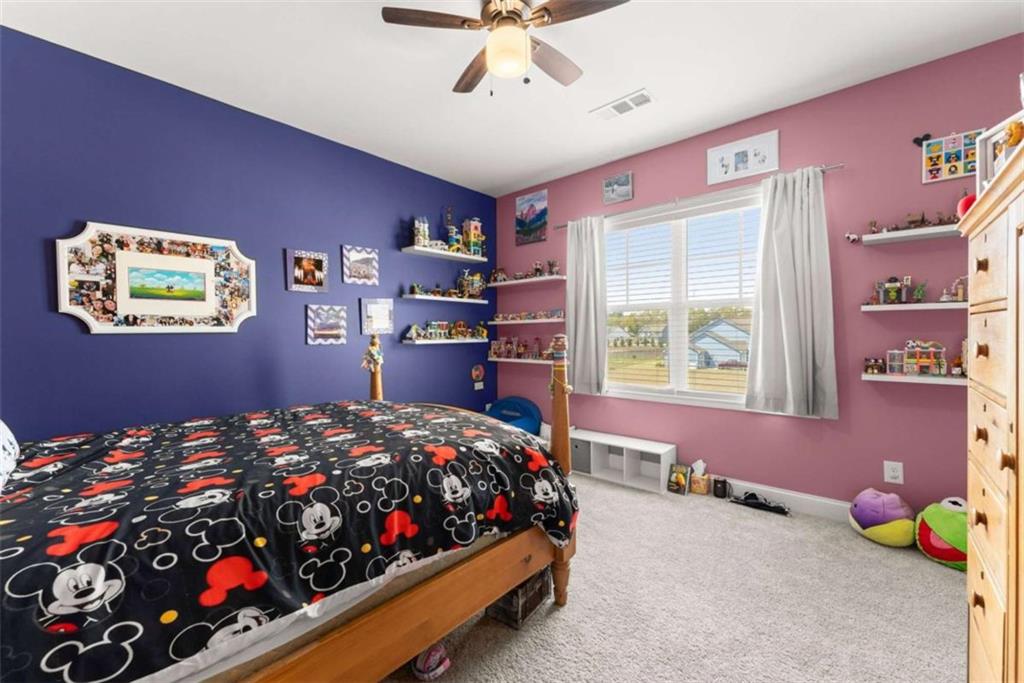 568 Dunagan Court Winder, GA 30680 - Photo 39 of 61 a bedroom with bed and a window
