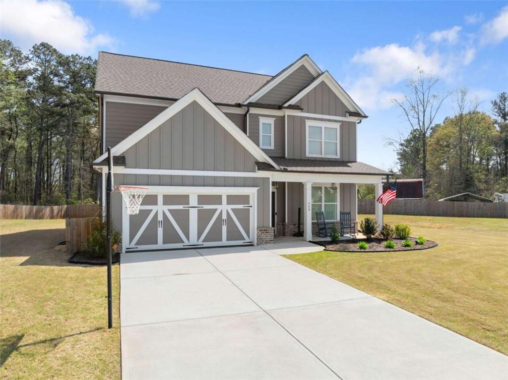 568 Dunagan Court Winder, GA 30680 - Photo 4 of 61 a front view of a house with a yard and garage