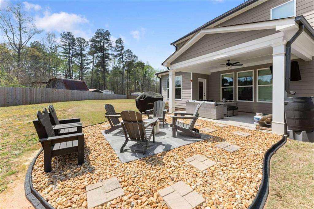 568 Dunagan Court Winder, GA 30680 - Photo 45 of 61 a view of a dinning table and chairs in the patio