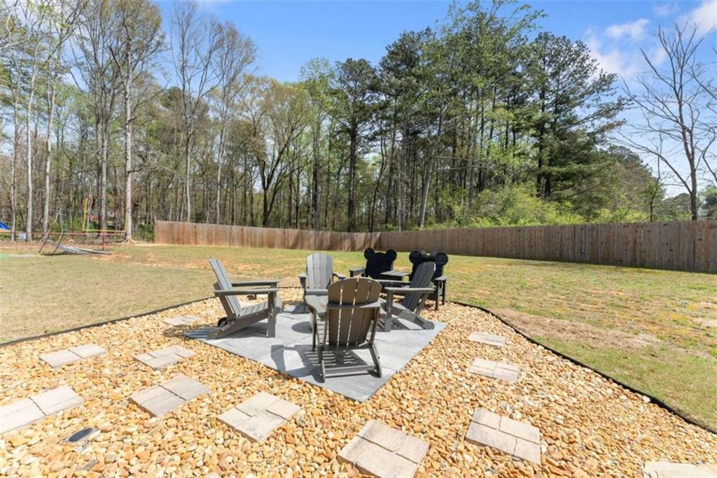 568 Dunagan Court Winder, GA 30680 - Photo 46 of 61 a view of a backyard with sitting area