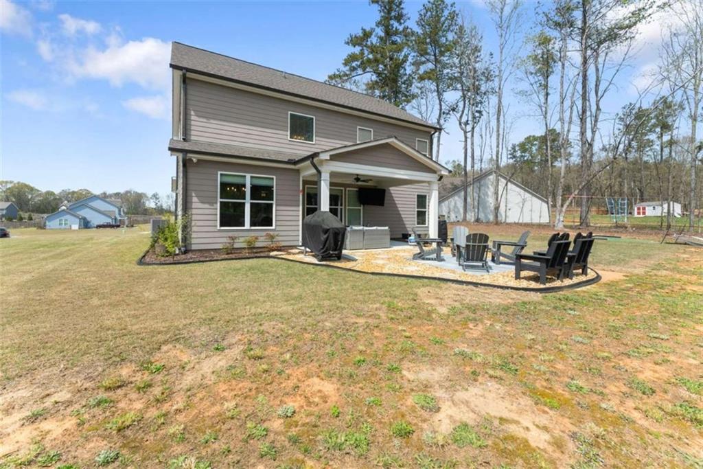 568 Dunagan Court Winder, GA 30680 - Photo 47 of 61 a view of a house with swimming pool and sitting area
