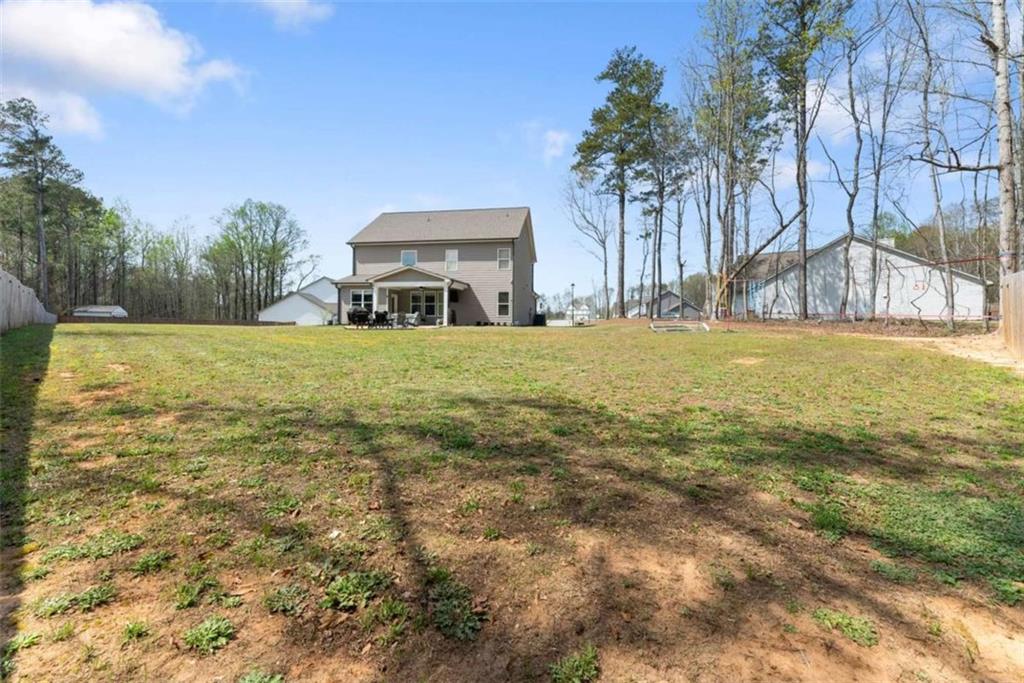 568 Dunagan Court Winder, GA 30680 - Photo 50 of 61 a big yard with trees in front of it